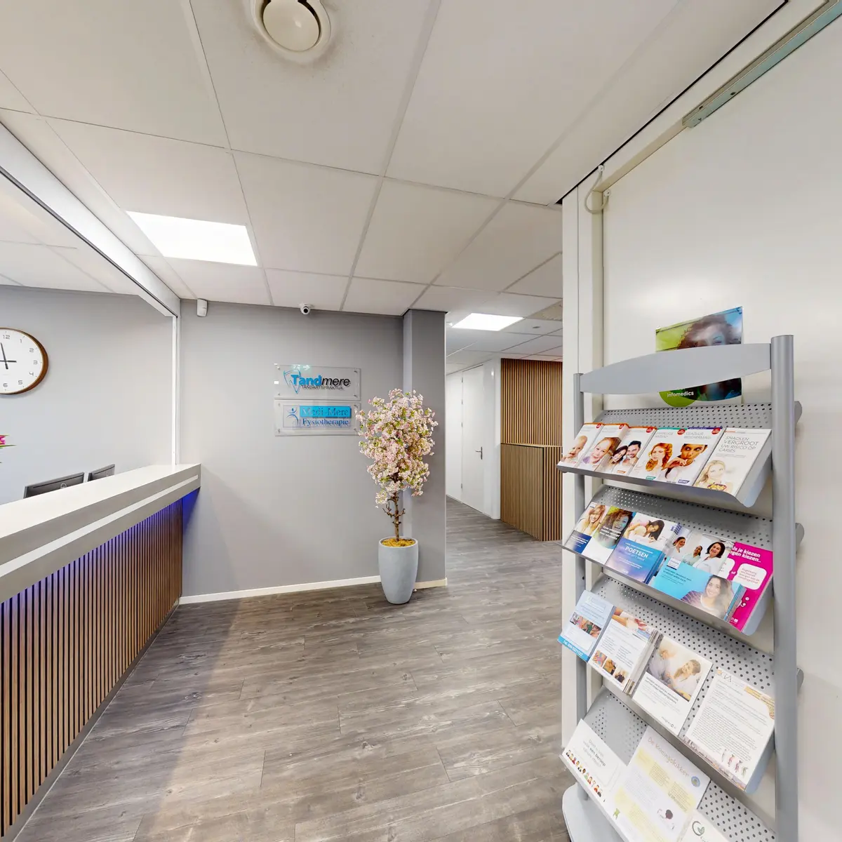 The reception desk with a leaflet rack in Almere-Poort